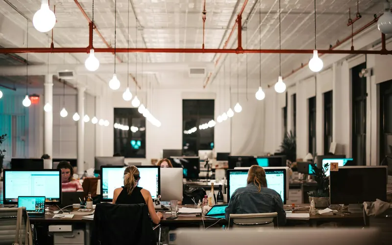 A software team working at computer screens